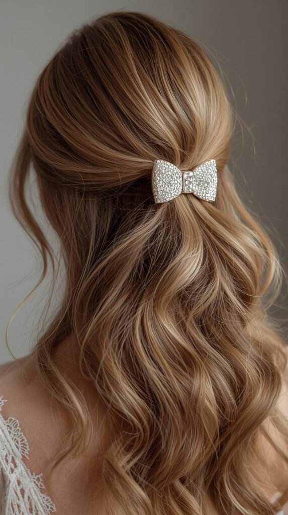 Woman with thin hair styled in a voluminous half-up ponytail with sparkly bow clip.
